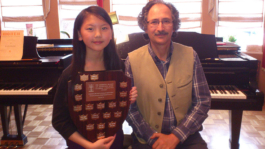Claire Liu with BCRMTA Highest Mark Trophy for her grade 10 RCM Piano   Exam
